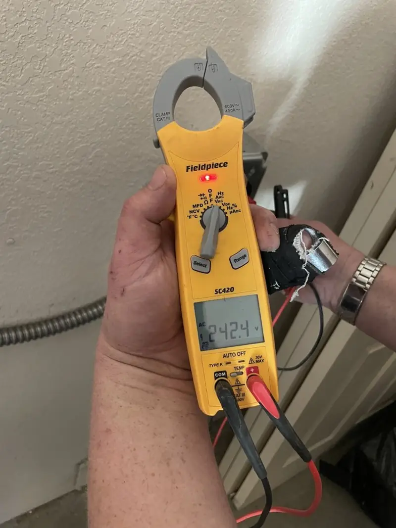 Voltage testing with clamp meter during Generator Installation in Iowa Falls